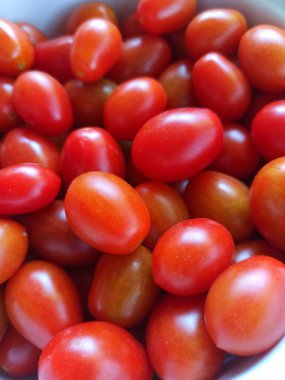 Kırmızı kiraz domatesleri. domates arka planı