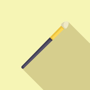 Makyaj fırçası açık sarı bir zeminde uzanıyor, uzun bir gölge bırakıyor.