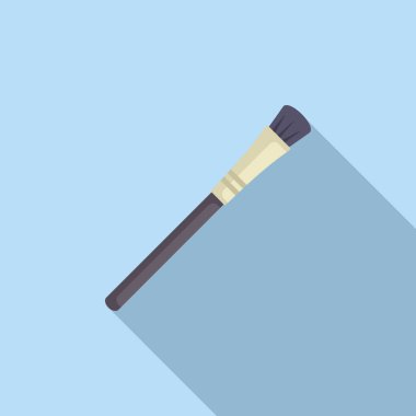 Makyaj fırçası mavi arka planda köşegen olarak uzanıyor, uzun bir gölge bırakıyor.