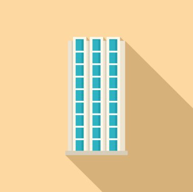 Geniş pencereli modern ofis binası güneşli bir günde uzun bir gölge bırakıyor