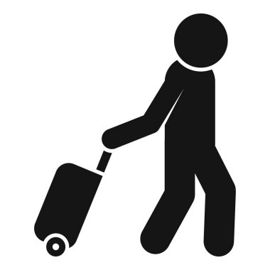 İş adamı yürüyor ve tekerlekli bavulu çekiyor.