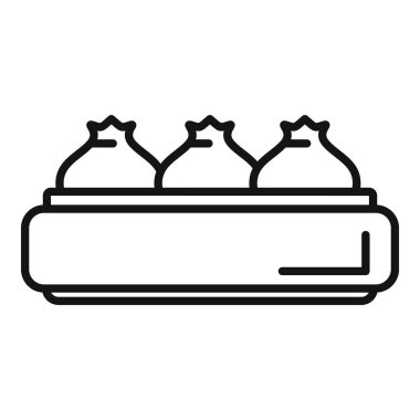 Buharlı sepetin içinde üç köfte var, buğulanmaya ve lezzetli bir yemek olarak servis edilmeye hazır.