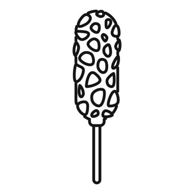 Çikolataya batırılmış fındık ve karamel kaplı bir çubuğun üzerinde tatlı mısır koçanı.