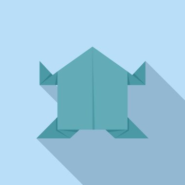 Mavi arka planda duran yeşil origami kaplumbağası, uzun bir gölge bırakıyor.