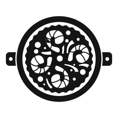 Yuvarlak tavada karidesler pişiyor.