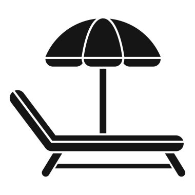 Plaj şemsiyesinin altında duran güneş yatağının siyah silueti yaz tatillerini temsil ediyor.