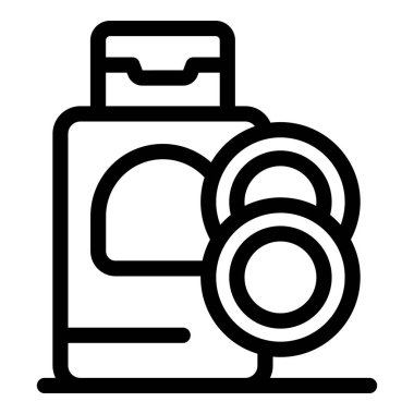 Kontakt lens solüsyonu şişesi yanında iki kontakt lensle duruyor.