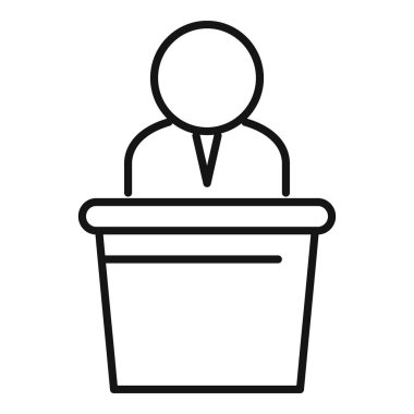 Politikacı podyumun arkasında duruyor, siyasi bir toplantıda konuşma yapıyor.