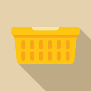 Havalandırma delikleri olan boş sarı plastik çamaşır sepeti yerde oturuyor, uzun bir gölge bırakıyor.