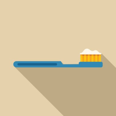 Mavi diş fırçası üzerinde diş macunu olan yatay bir şekilde uzanıyor.