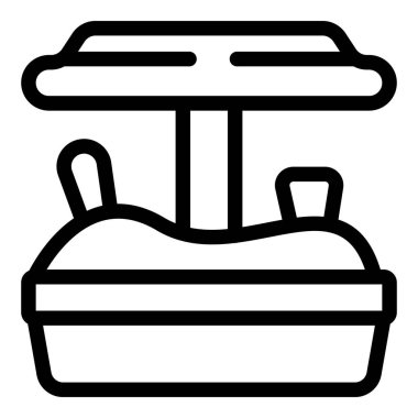 Güneşli bir günde dışarıda oynayan bir çocuk için oyuncak dolu kum havuzu.