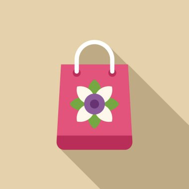 Şekil verilmiş çiçek logosuna sahip pembe alışveriş torbası açık kahverengi arka planda uzun bir gölge bırakıyor.