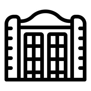 Büyük süslü metal kapı bir binanın girişini kapatıyor.