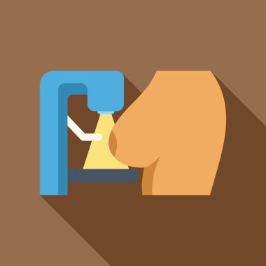 Meme kanserinin erken teşhisi için mammografi çekilen bir kadın.