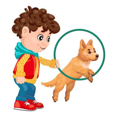 Gülümseyen çocuk köpeğini çemberden atlaması için eğitiyor.