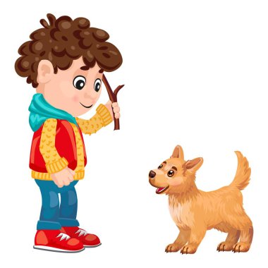 Neşeli çocuk elinde sopayla mutlu kahverengi bir köpek yavrusuyla oynuyor.