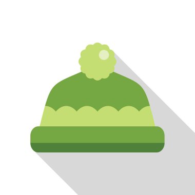 Puflu yeşil kış şapkası beyaz arka planda uzun bir gölge bırakıyor.