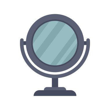 Yuvarlak masaüstü makyaj aynası bir masanın üzerinde duruyor, bilinmeyen bir kaynaktan gelen ışığı yansıtıyor