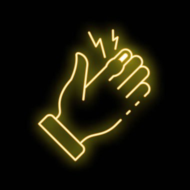 Elektrik şoku yaşayan sarı, neon renkli bir el.