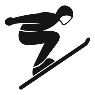 Profesyonel kayakçı yarışma veya antrenman sırasında kayak ve spor kıyafetleriyle atlıyor.