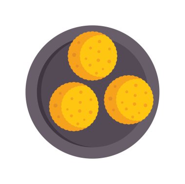 Yuvarlak siyah tabakta üç altın kurabiye, yukarıdan atılmış delikler.