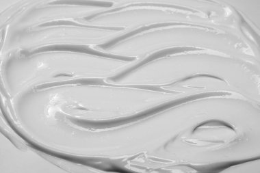 Güzellik kremi dokusu. Kozmetik losyon arka planı. Kremalı cilt ürünleri yakın çekim.