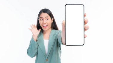 beautiful Asian young woman ,Excited surprised girl showing smart phone with blank screen , white screen for Mobile App Advertising isolated on white background , smart phone display Mock Up Image