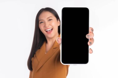 beautiful Asian young woman ,Excited surprised girl showing smart phone with blank screen , black screen for Mobile App Advertising isolated on white background , smart phone display Mock Up Image