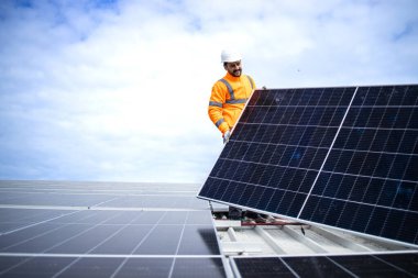 Process of solar panel installation in sustainable energy power plant.