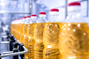 Industrial vegetable oil production in bottling factory.