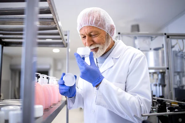 Experienced Pharmaceutical Worker Testing Smell Aging Cream Cosmetic Factory — ストック写真