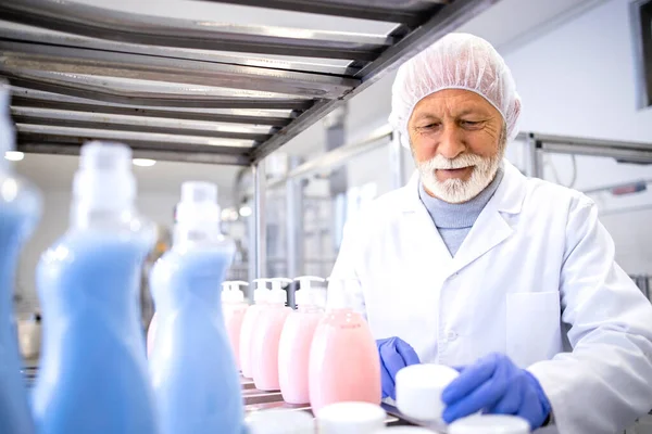 Pharmaceutical technologist working in cosmetics factory.