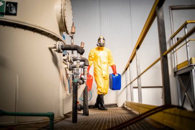 Working in chemicals production plant controlling acid tank pressure.