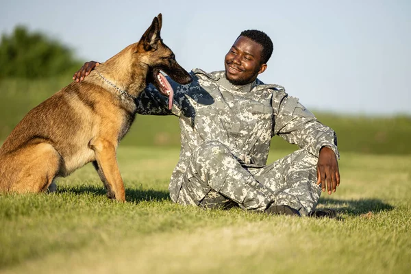 Soldier and his military dog getting to know each other in free time.