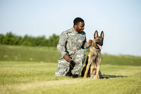 Friendship between soldier and military dog.