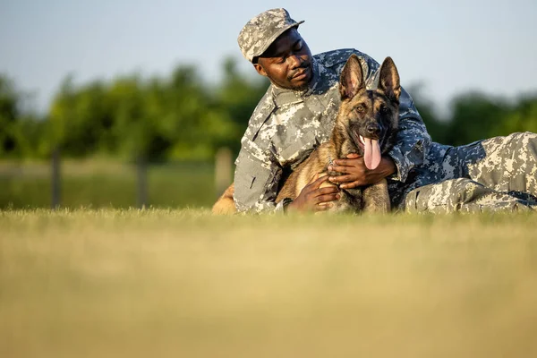 Friendship between soldier and military dog.