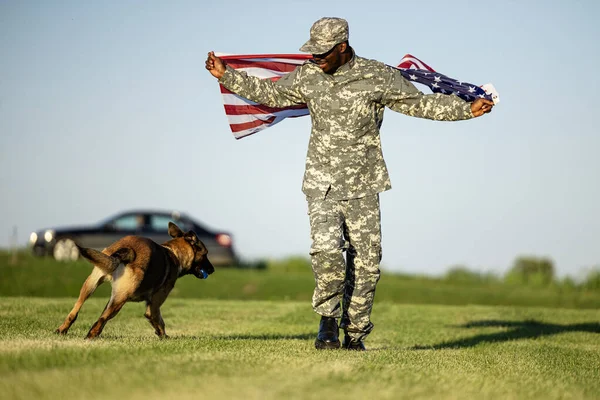 Soldier and military dog celebrating patriotism and freedom of their country.