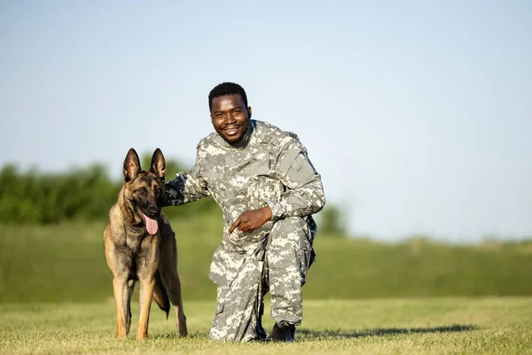 Soldier an military working dog training together.
