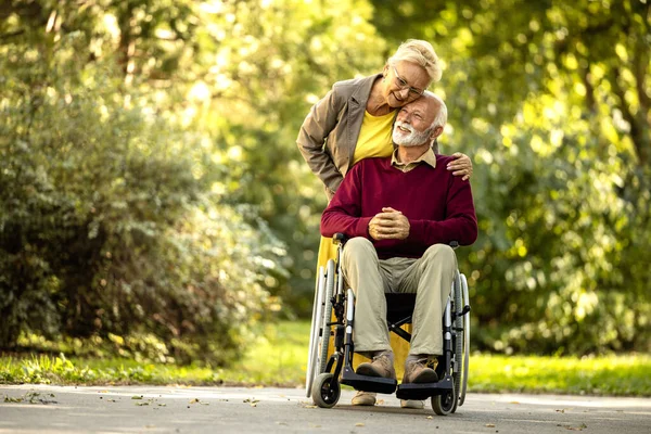 Senior Woman Taking Care Elderly Man Wheelchair Showing Love Respect Stock Picture