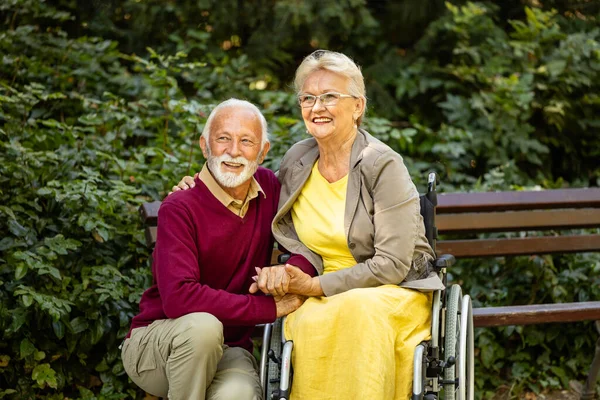 Senior Couple Park Holding Hands Together Looking Distance Stock Image