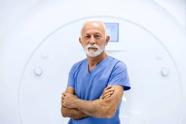 Portrait of senior man with health problems preparing for MRI scan in hospital.