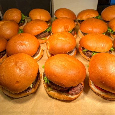Catering american style - plenty of hamburgers. hamburger is food consisting of fillings - usually patty of ground meat, typically beef - placed inside sliced bun or bread roll.