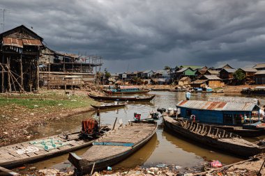 Poor Cambodians living in poverty along a river in South East Asia
