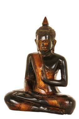 Close up of a wooden Buddha Statue that is meditating on a white background