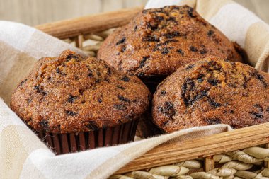 Delicious homemade Banana Choco Muffins on a wooden table