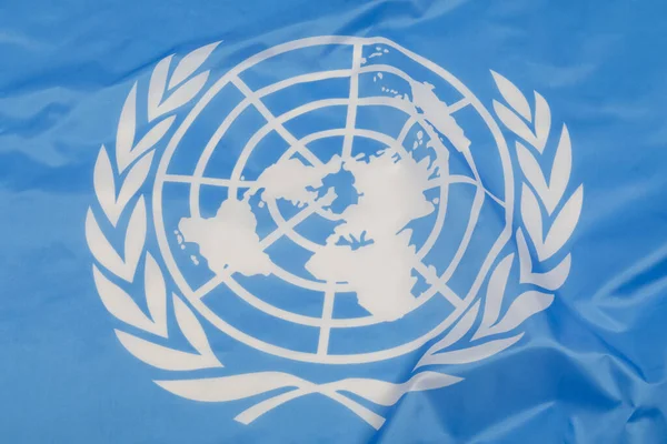 Close up of the emblem on the United Nations flag