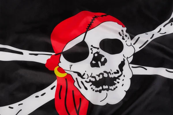 海盗黑旗的骷髅和交叉骨骼也叫快乐罗杰 — 图库照片
