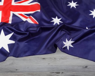 Australian Flag known officilly as the Commonwealth of Australia with wooden background and copy space