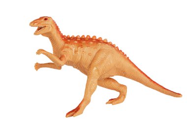 Plastik oyuncak dinozor beyaz bir arkaplanda izole edilmiş ve kopyalama alanı var.