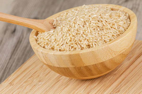 Close Wooden Bowl Delicious Uncooked Brown Rice Copy Space — Stock Photo, Image
